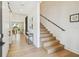 Bright hallway with hardwood floors, staircase, and views into the open-concept living spaces, creating a welcoming entry at 411 W Frances Ave # 2, Tampa, FL 33602