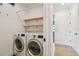 Bright laundry room with shelving, washer and dryer at 411 W Frances Ave # 2, Tampa, FL 33602