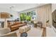 Bright, open living room boasts hardwood floors, large sliding doors to a backyard patio, and modern decor at 411 W Frances Ave # 2, Tampa, FL 33602