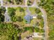 Large lot with a large two-story home, pool, circular drive and mature trees provide privacy at 4180 Jacaranda Cir, Brooksville, FL 34604