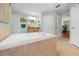 Bathroom featuring a large soaking tub, tiled floors, and light green walls at 4180 Jacaranda Cir, Brooksville, FL 34604