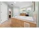 Bathroom featuring a large soaking tub, tiled floors, and light green walls at 4180 Jacaranda Cir, Brooksville, FL 34604