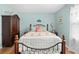 Tranquil bedroom with decorative touches, wood floors, ceiling fan, furnishings and a well-lit window at 4180 Jacaranda Cir, Brooksville, FL 34604