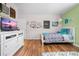 Inviting bedroom showcasing a twin bed, TV, and decor at 4180 Jacaranda Cir, Brooksville, FL 34604