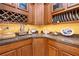 Butler's pantry features custom cabinets, wine storage, and counter space at 4180 Jacaranda Cir, Brooksville, FL 34604
