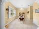 Elegant dining room with a chandelier, decorative shelving, and large windows at 4180 Jacaranda Cir, Brooksville, FL 34604