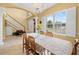Elegant dining room adjacent to the foyer and stairs, flooded with natural light at 4180 Jacaranda Cir, Brooksville, FL 34604