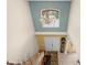 Bright foyer featuring a chandelier, double doors, and staircase at 4180 Jacaranda Cir, Brooksville, FL 34604