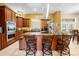 Open kitchen layout with stainless steel appliances, island, and access to the backyard at 4180 Jacaranda Cir, Brooksville, FL 34604