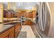 A modern kitchen with stainless steel appliances, ample counter space, and custom wood cabinets at 4180 Jacaranda Cir, Brooksville, FL 34604