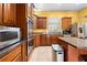 Gourmet kitchen with stainless steel appliances and custom cabinetry at 4180 Jacaranda Cir, Brooksville, FL 34604