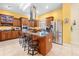 Spacious kitchen with stainless steel appliances and a large island with bar stool seating at 4180 Jacaranda Cir, Brooksville, FL 34604