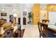 Open-concept layout with a dining area, decorative columns, and tile flooring at 4180 Jacaranda Cir, Brooksville, FL 34604