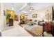 Spacious living room featuring an ornamental rug, sectional sofa, and elegant décor at 4180 Jacaranda Cir, Brooksville, FL 34604