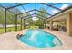 Aerial view of pool and patio area, highlighting ample space for outdoor living and entertaining at 4180 Jacaranda Cir, Brooksville, FL 34604