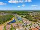 Gorgeous aerial shot of the neighborhood highlighting the home, pond, and surrounding landscape at 4275 Burdick Loop, Odessa, FL 33556