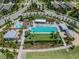 Aerial view of a community pool, splash pad and lounging areas at 4275 Burdick Loop, Odessa, FL 33556