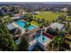 An aerial view highlights community pool, splash pad, and recreational areas at 4275 Burdick Loop, Odessa, FL 33556