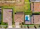 Aerial view showcasing the backyard, pool, and the layout of neighboring homes at 4275 Burdick Loop, Odessa, FL 33556