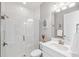 Bright bathroom featuring a glass-enclosed shower with white subway tile and a modern vanity at 4275 Burdick Loop, Odessa, FL 33556