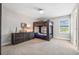 bedroom with a dresser, carpeted floor, bunk beds and a window with shade at 4275 Burdick Loop, Odessa, FL 33556