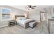 Spacious bedroom with a large bed, plush carpeting, and side tables with lamps at 4275 Burdick Loop, Odessa, FL 33556