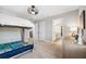 Bedroom with bed and open bathroom, and modern fixtures at 4275 Burdick Loop, Odessa, FL 33556