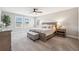 Bright and spacious bedroom featuring plush carpet, neutral tones, and a large bed at 4275 Burdick Loop, Odessa, FL 33556