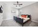 Cozy bedroom with soft carpet, ceiling fan, and simple decor at 4275 Burdick Loop, Odessa, FL 33556