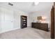 bedroom with a dresser, bookshelf, carpeted floor and a window with shade at 4275 Burdick Loop, Odessa, FL 33556