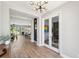 Welcoming foyer with wood flooring and an open view to the dining and living spaces at 4275 Burdick Loop, Odessa, FL 33556