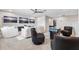 Game room features comfortable modern seating, a gaming console, plush carpet and plenty of light at 4275 Burdick Loop, Odessa, FL 33556