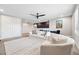 Comfortable game room features soft lighting, modern seating, and light colored carpet at 4275 Burdick Loop, Odessa, FL 33556