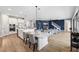 Bright and spacious kitchen features a large island with seating and a dining area, open to the living room at 4275 Burdick Loop, Odessa, FL 33556