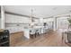Well-appointed kitchen with white cabinets, stainless steel appliances, a modern light fixture and bar stool seating at 4275 Burdick Loop, Odessa, FL 33556