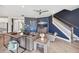 Inviting living area with hardwood floors, staircase, and contemporary furnishings at 4275 Burdick Loop, Odessa, FL 33556