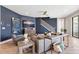 Cozy living room with hardwood floors, modern decor, and staircase at 4275 Burdick Loop, Odessa, FL 33556