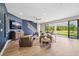 Bright living area with hardwood floors, staircase, and sliding glass doors at 4275 Burdick Loop, Odessa, FL 33556