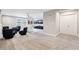 Open concept living room, with plush carpeting and a variety of seating areas at 4275 Burdick Loop, Odessa, FL 33556