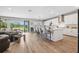 Open-concept living space featuring a kitchen island, and a seamless flow to the outdoors at 4275 Burdick Loop, Odessa, FL 33556