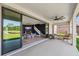 Covered patio features an open view of the house's interior and the backyard at 4275 Burdick Loop, Odessa, FL 33556