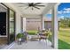 Covered patio with comfortable seating at 4275 Burdick Loop, Odessa, FL 33556