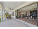 Covered patio with dining area and view of the kitchen and living room at 4275 Burdick Loop, Odessa, FL 33556