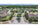Community aerial view featuring gated entry, beautiful landscaping, and well-maintained homes at 4300 Barletta Ct, Wesley Chapel, FL 33543