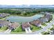 Breathtaking aerial view of the community, highlighting the homes, a scenic lake, and green spaces at 4300 Barletta Ct, Wesley Chapel, FL 33543