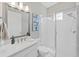 Modern bathroom features a glass-enclosed shower and vanity with dual sinks at 4300 Barletta Ct, Wesley Chapel, FL 33543