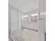 Stylish bathroom features a dual vanity, granite countertops, and a modern glass-enclosed shower at 4300 Barletta Ct, Wesley Chapel, FL 33543