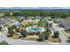 Beautiful aerial view of the community pool with lush landscaping, cabanas, and inviting atmosphere at 4300 Barletta Ct, Wesley Chapel, FL 33543