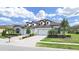 Charming single-story home with a three-car garage, complemented by lush landscaping and a brick driveway at 4300 Barletta Ct, Wesley Chapel, FL 33543