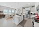 Kitchen featuring a center island with stainless steel appliances and views of the dining room at 4300 Barletta Ct, Wesley Chapel, FL 33543